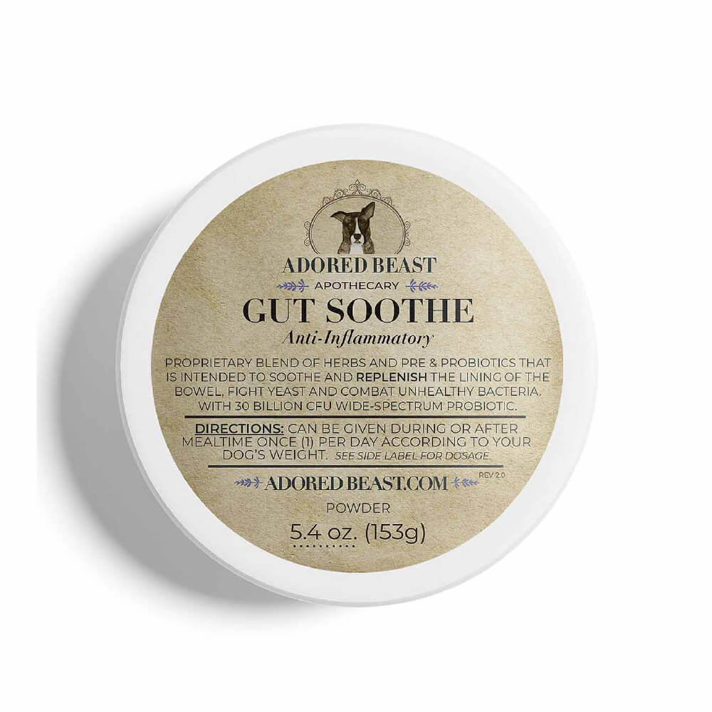 A container of Adored Beast Gut Soothe, an anti-inflammatory health supplement for dogs, with a label showing the brand logo, product name, and additional details.