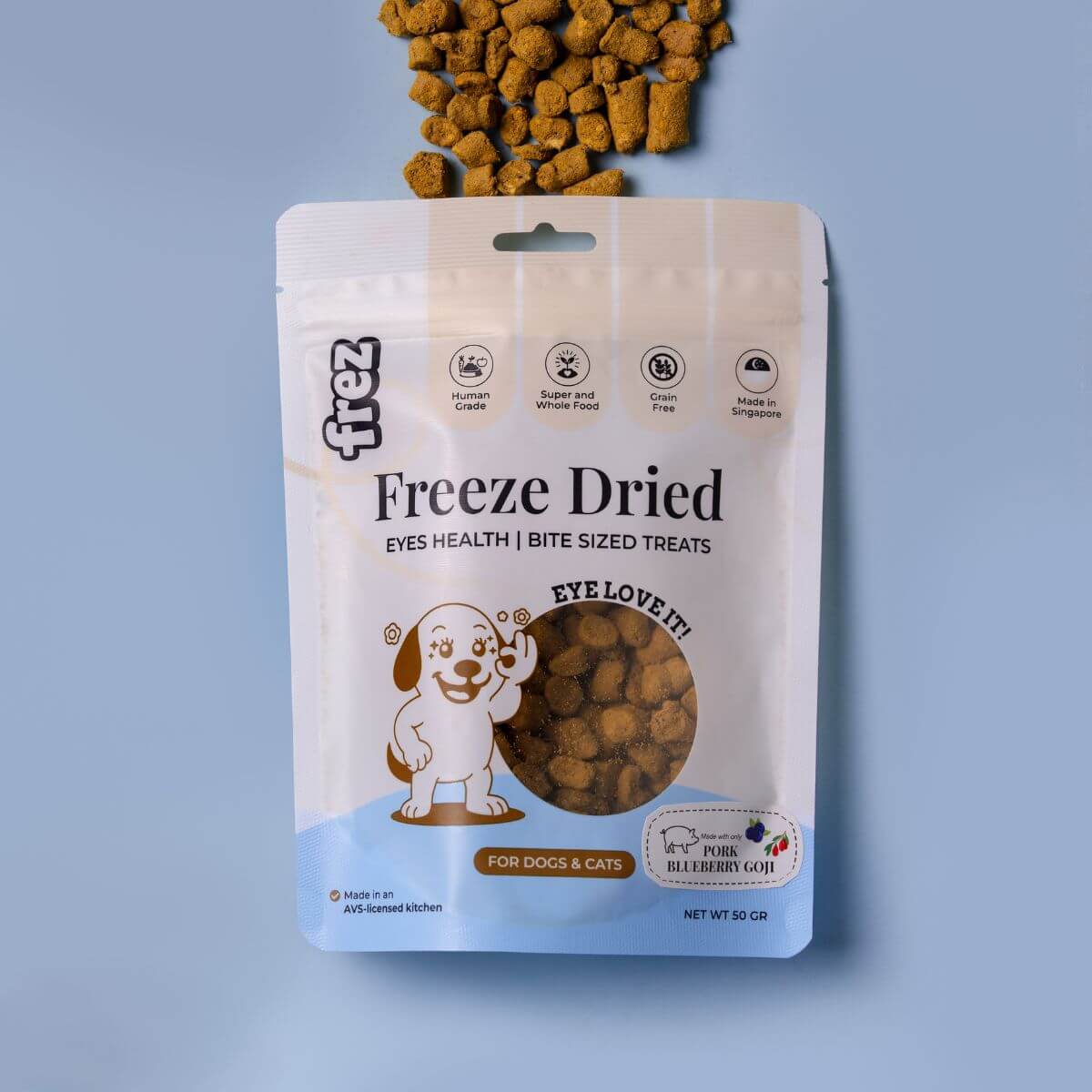 Frez Eyes Health Freeze Dried Pork with Blueberry & Goji Treats against a blue background.