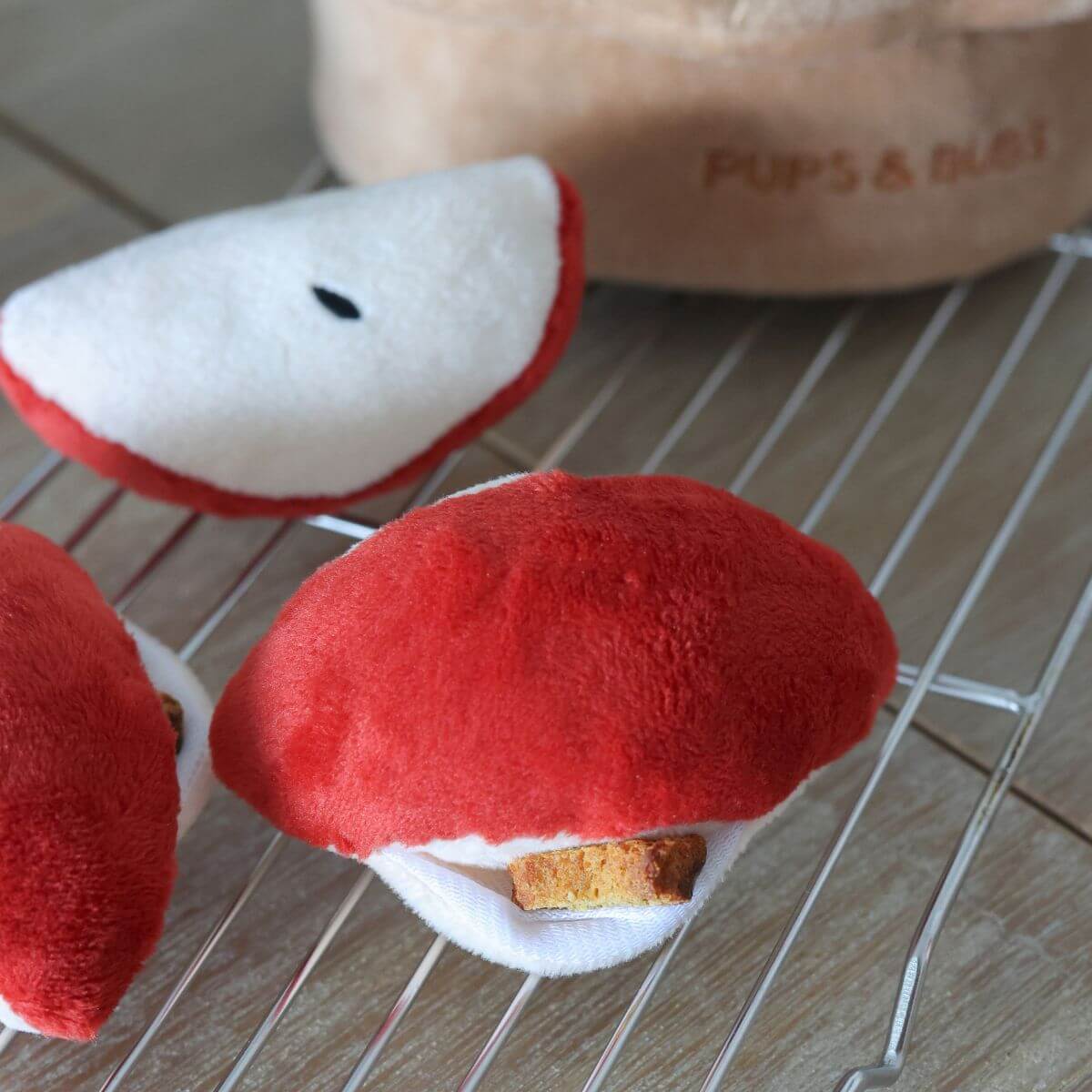 Slices of the Pups and Bubs Apple Pie Nosework Toy on a rack.