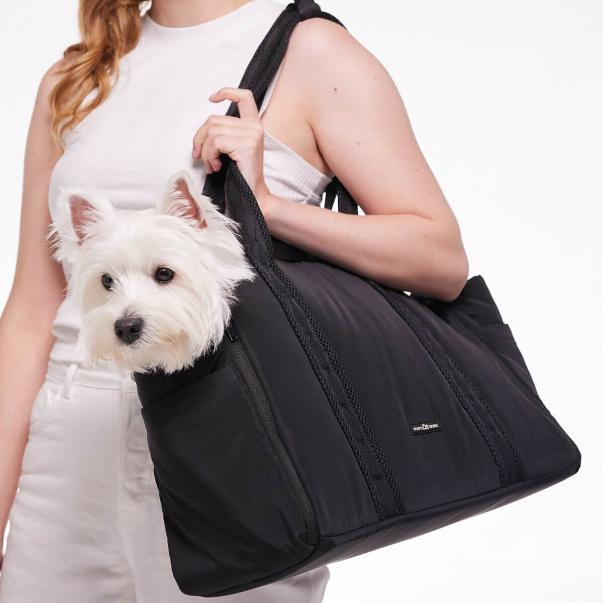 Pups and Bubs Everywhere Convertible Tote Bag Carrier in black with a West Highland Terrier in it.