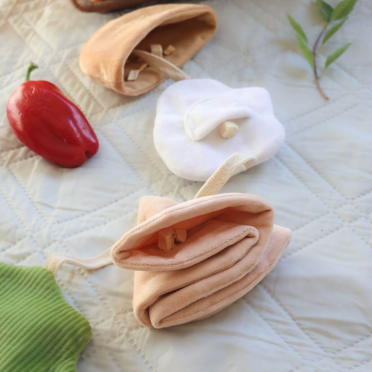 Hidden pockets in the Pups and Bubs Pita Pocket Nosework Toy.