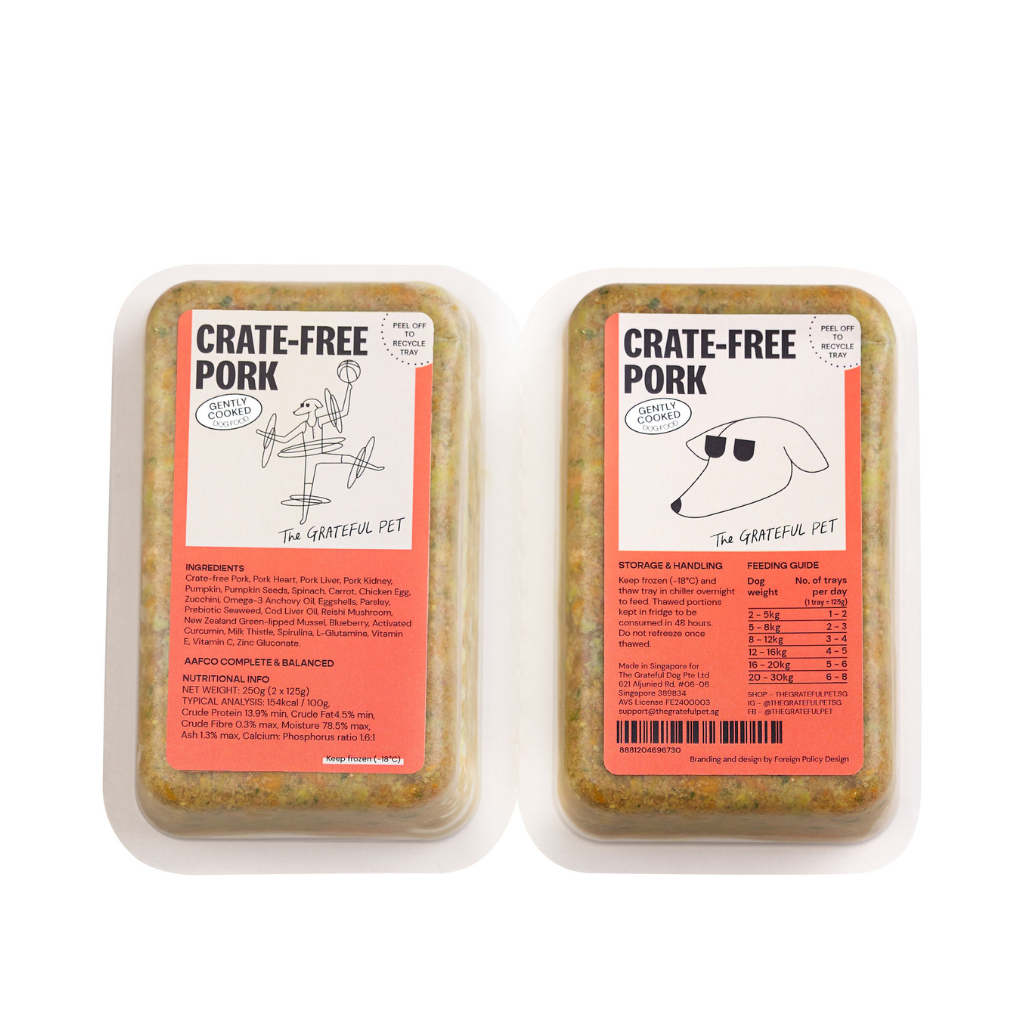Two packages of 'Crate-Free Pork' by The Grateful Pet on a white background