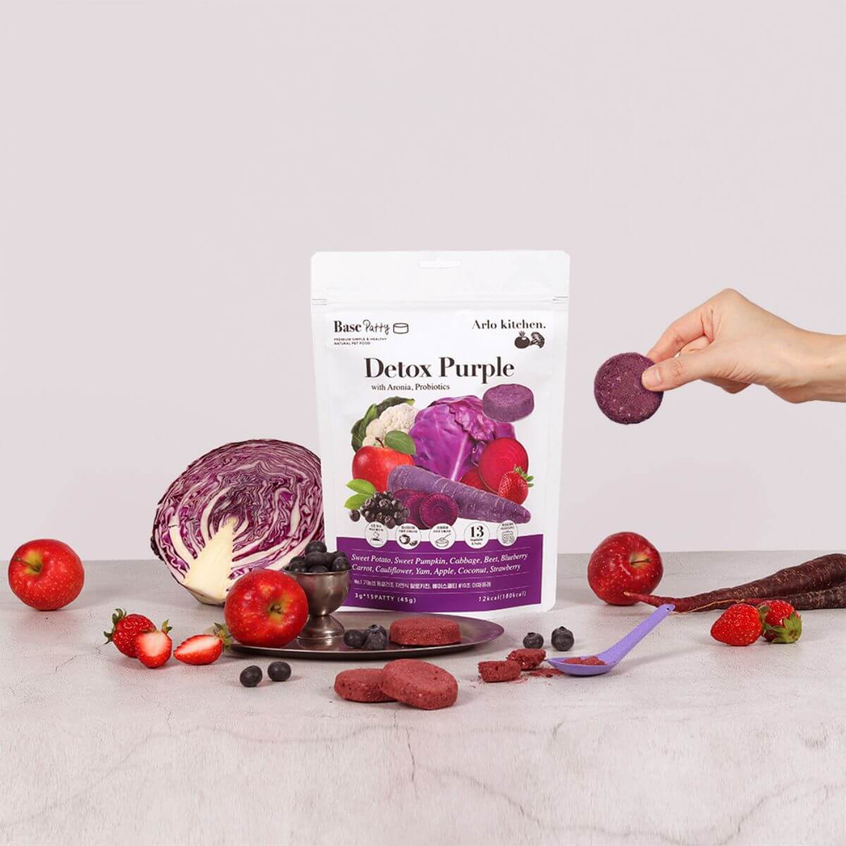 Arlo Kitchen Detox Purple Veggie Patties against a white background and the ingredients around it.