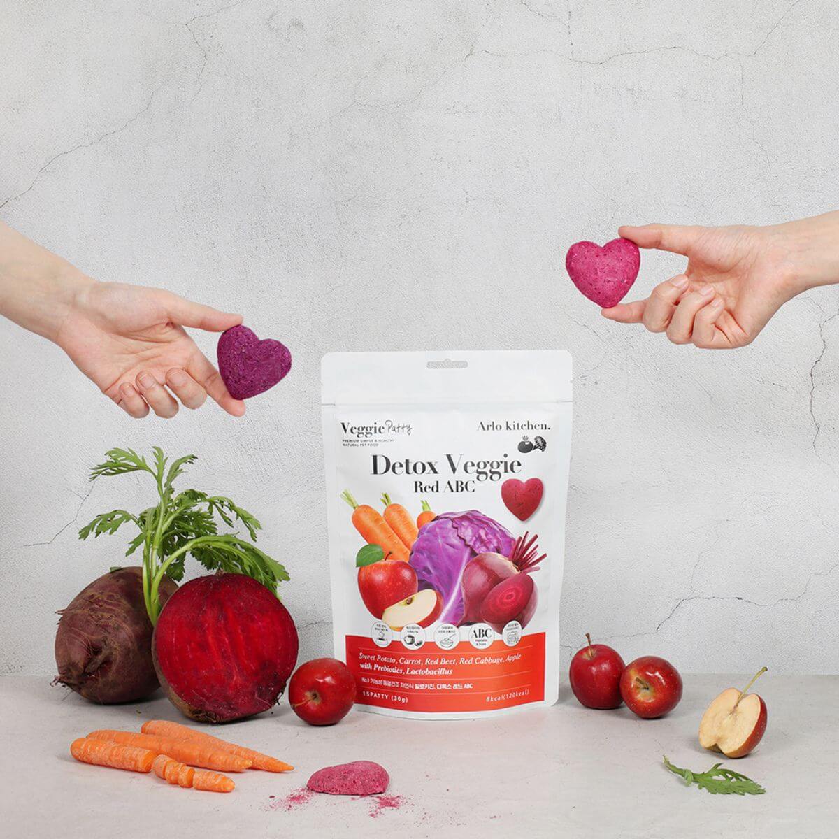 Arlo Kitchen Detox Red ABC Veggie Patties against a grey background and the ingredients around it.