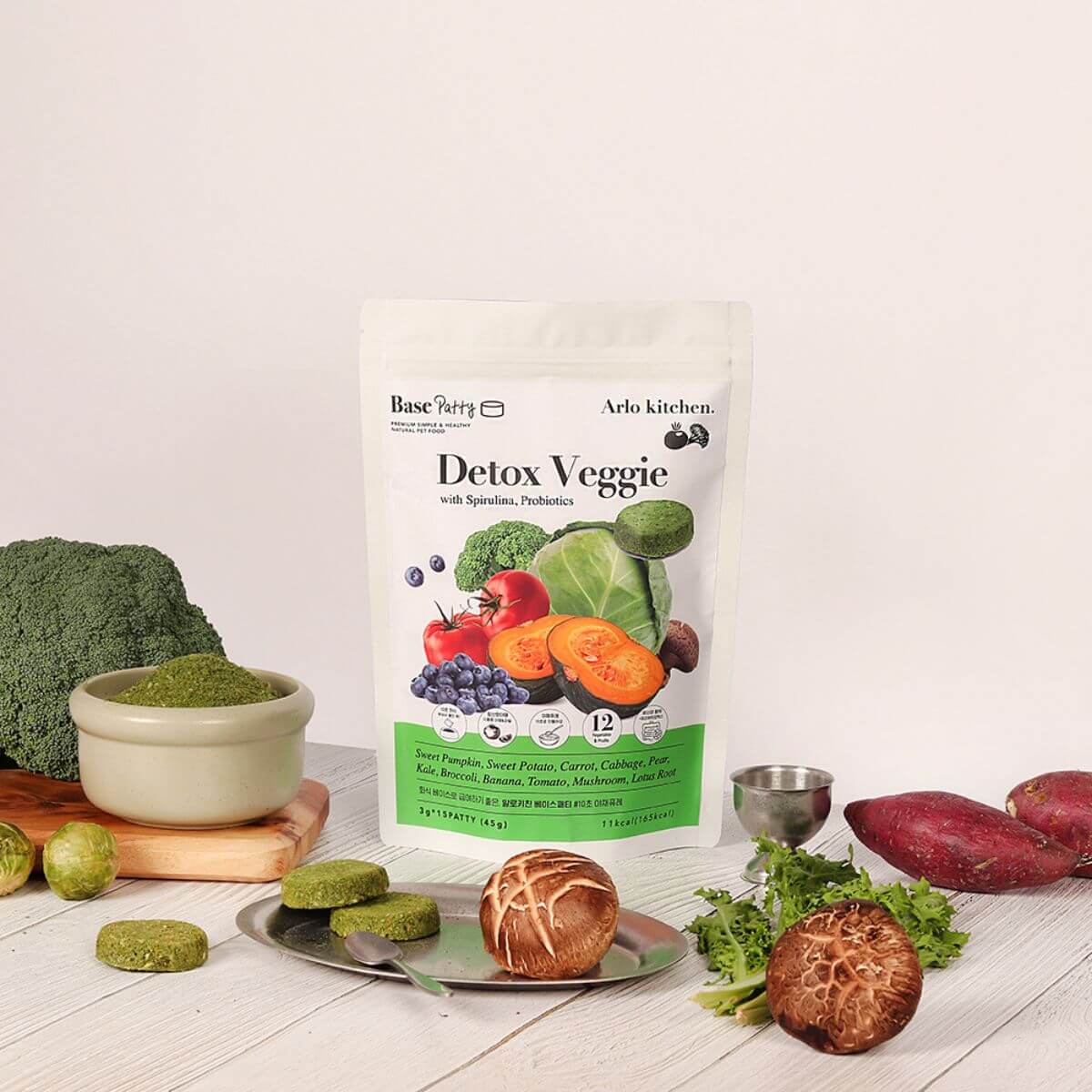 Arlo Kitchen Detox Veggie Patties with the ingredients scattered around it against a white background.