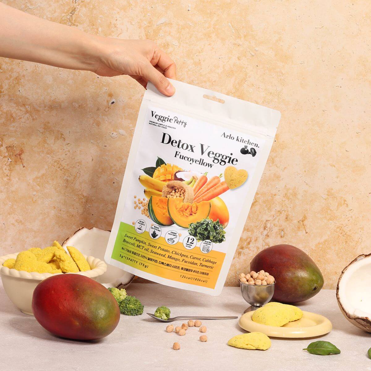 Arlo Kitchen Detox Yellow Veggie Patties with its ingredients around it.