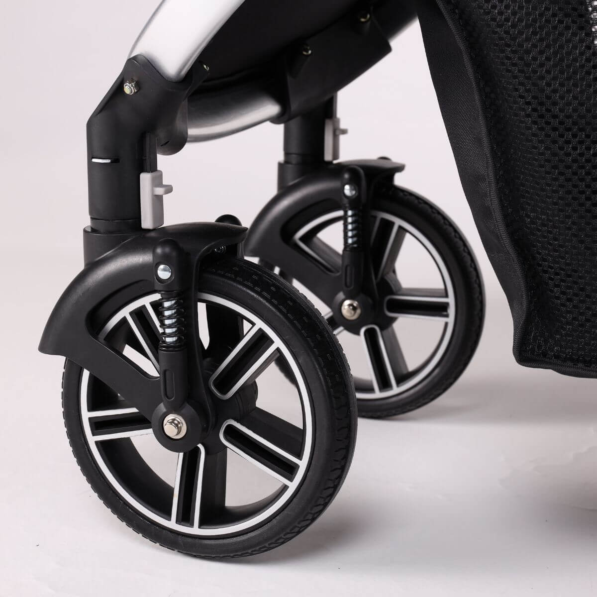 Wheels of the Bernd Pets Prime V2 with ISOFIX Glacier Grey against a white background.