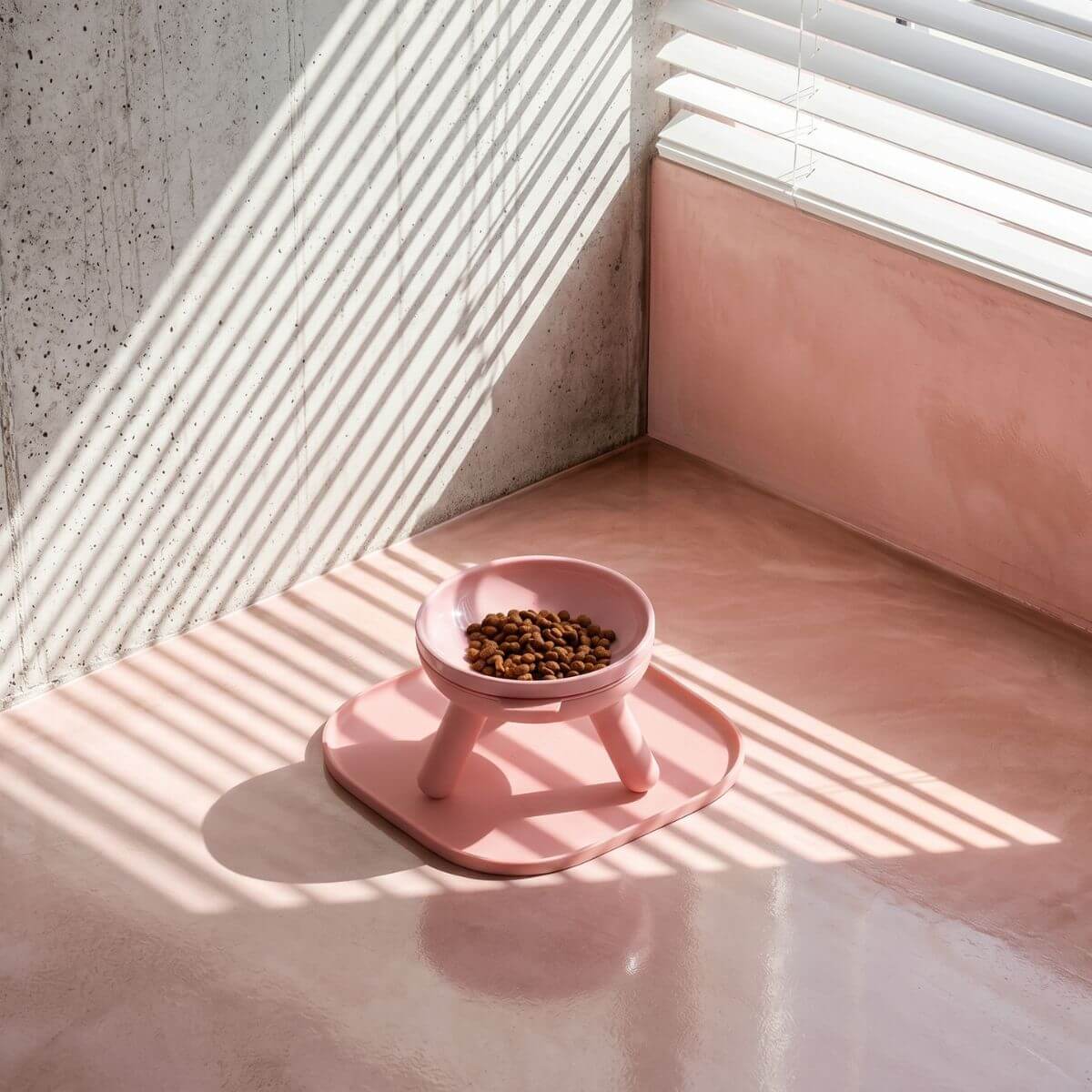 inherent outdoor oreo table in baby pink in a balcony in sunlight