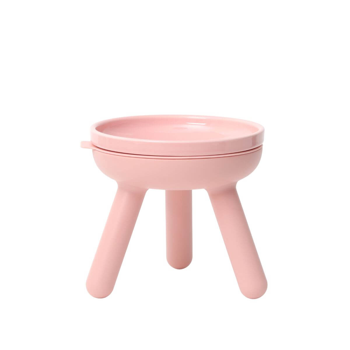 inherent outdoor oreo table in baby pink against a white background.