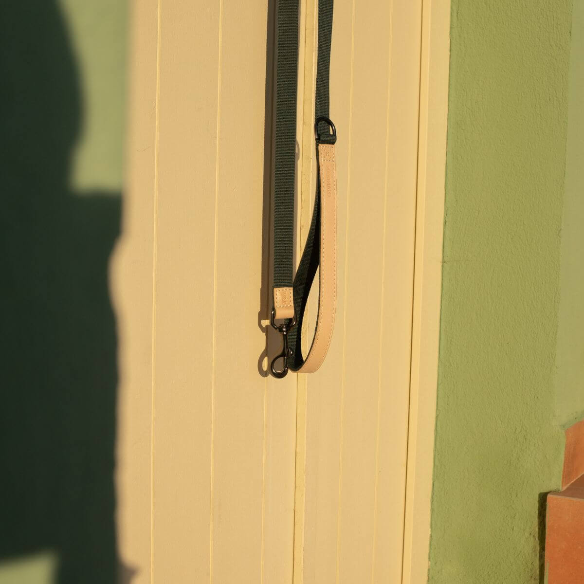 Masimalo Lead in Natural / Pine hanging from a wall.