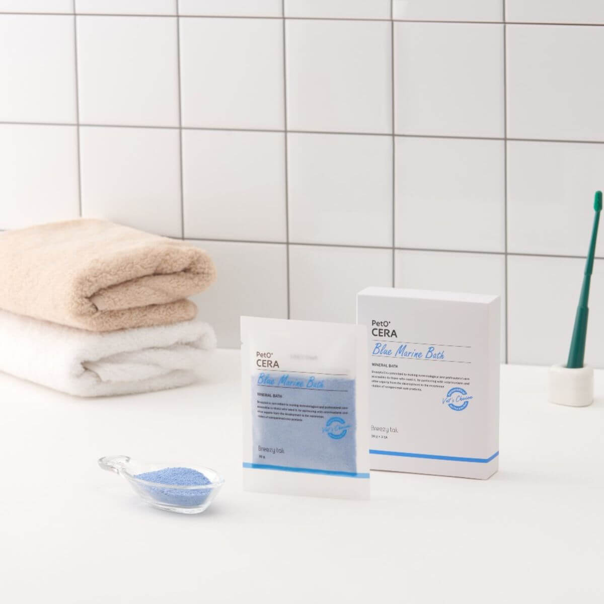 PetO'CERA Spa Blue Marine Bath against the bathroom tiles.