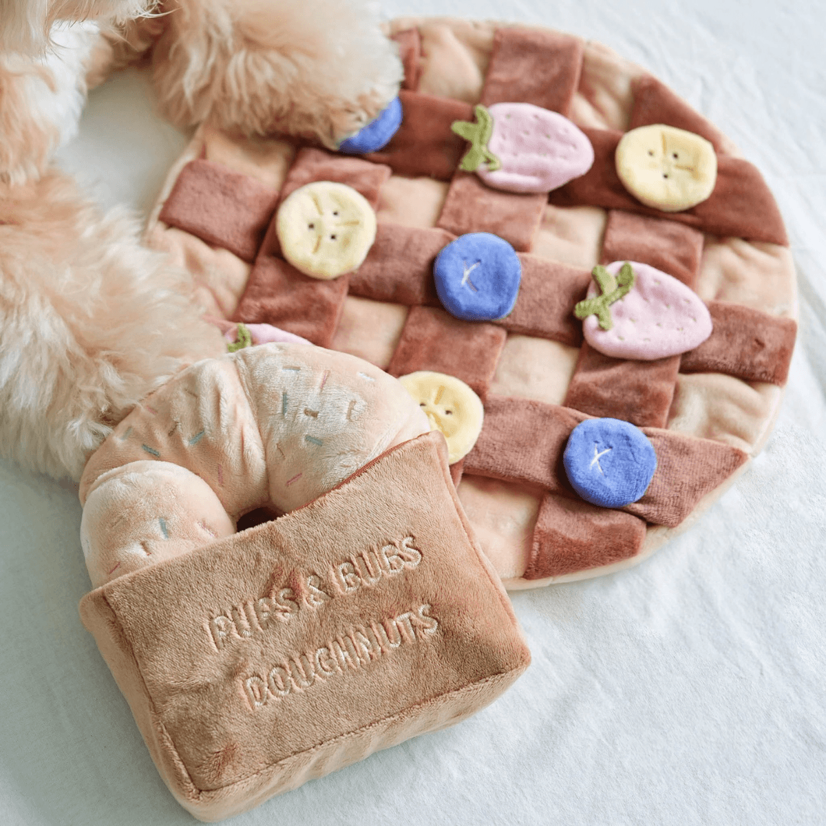 pups and bubs fruity delight crepe snuffle mat and the sprinkle donut against a white background.