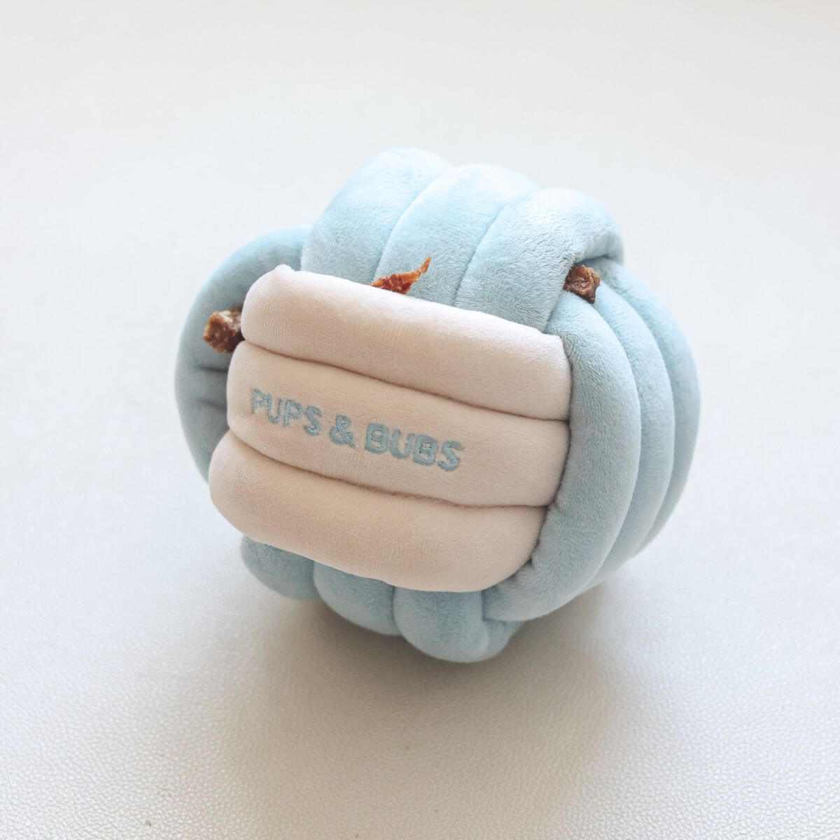 Pups & Bubs Snuffle Knot with treats in its hidden pockets.