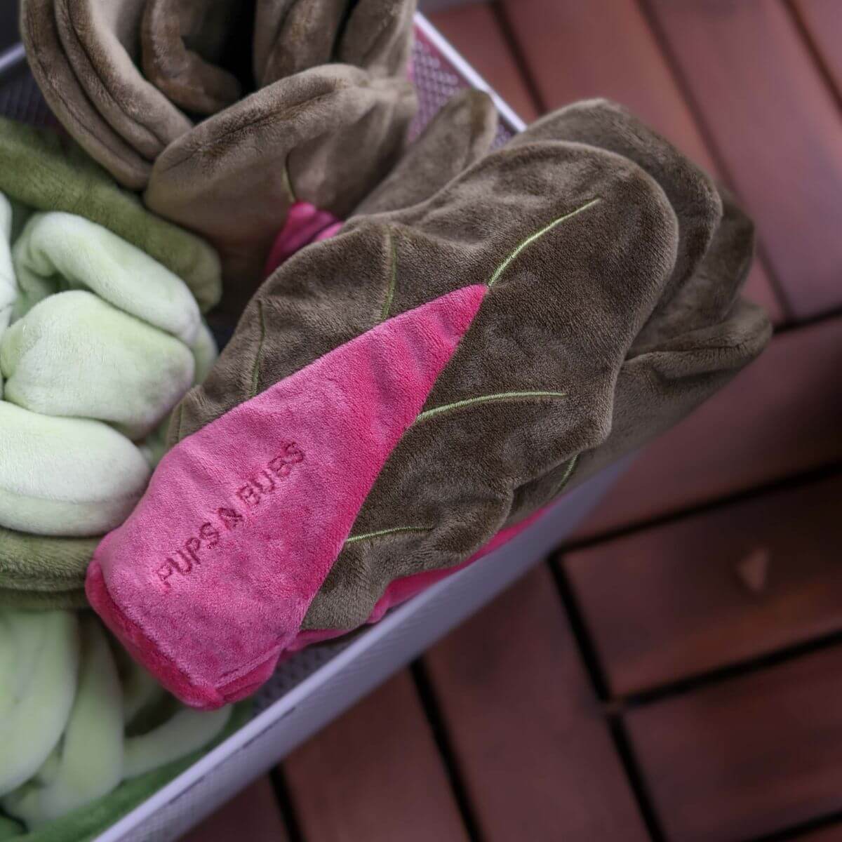 Pups & Bubs Snuffle Swiss Chard Nosework Toy in a basket.