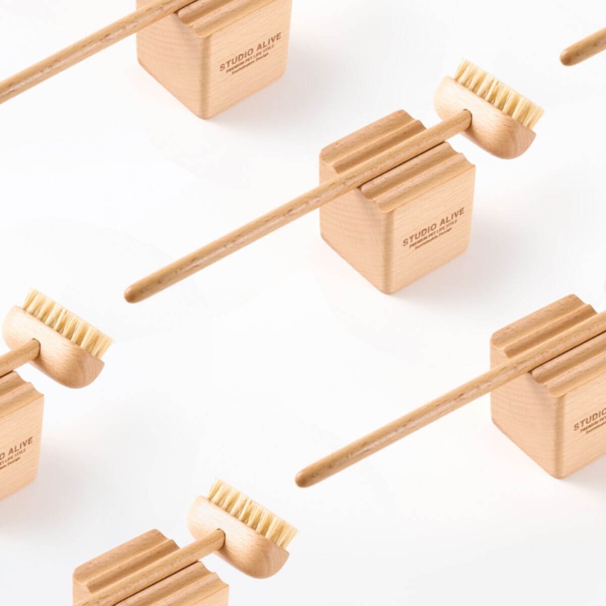 Studio Alive Allo Grooming Brush against a white background.