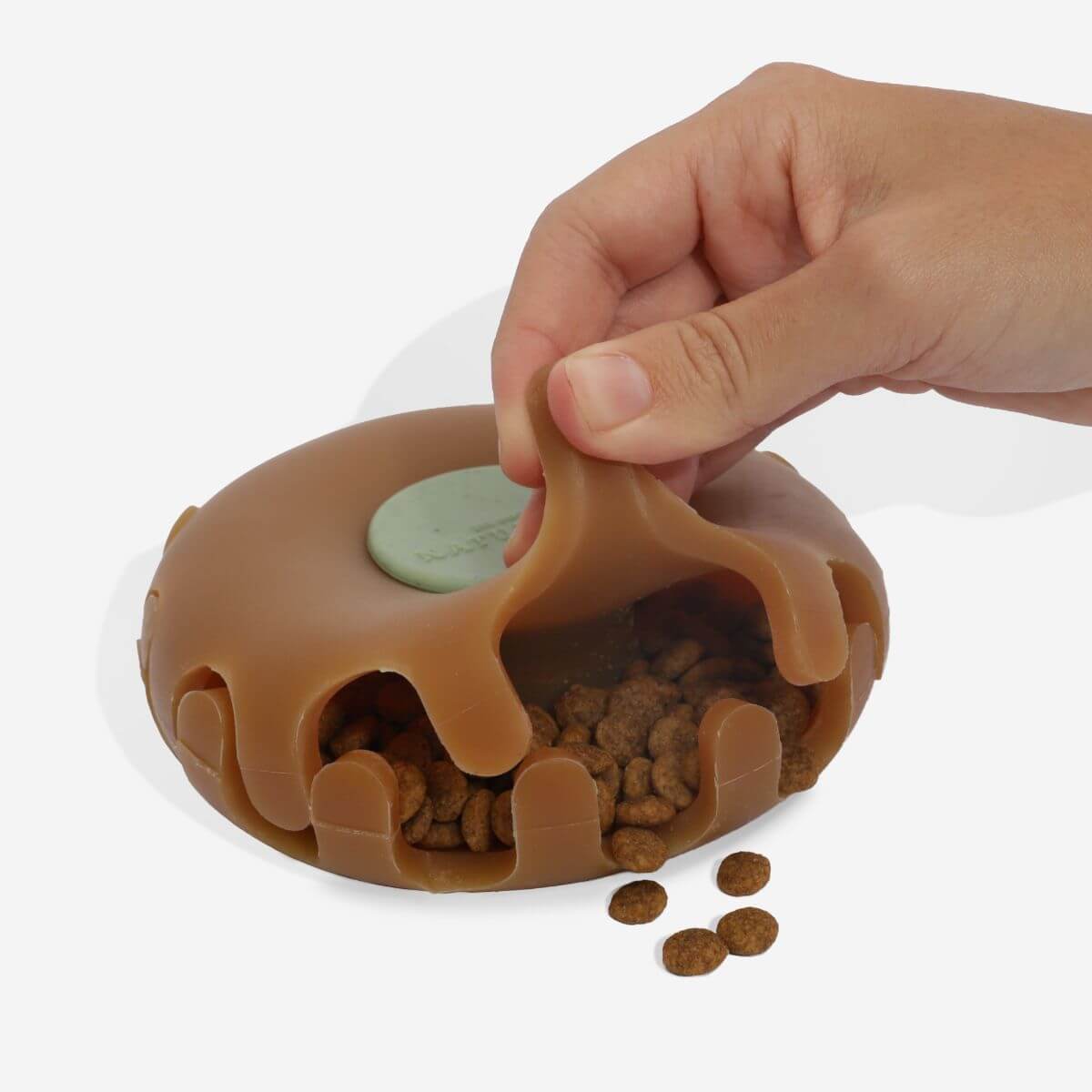 Zee.Dog Naturals Treat Dispenser Toy against a white background.