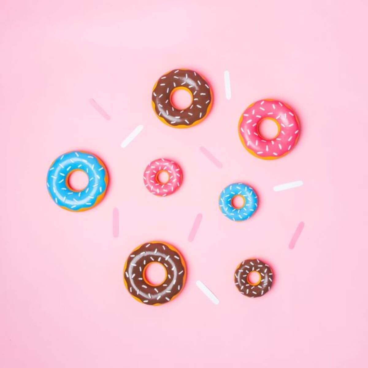 ZippyPaws Tuff Donutz series against a pink background.