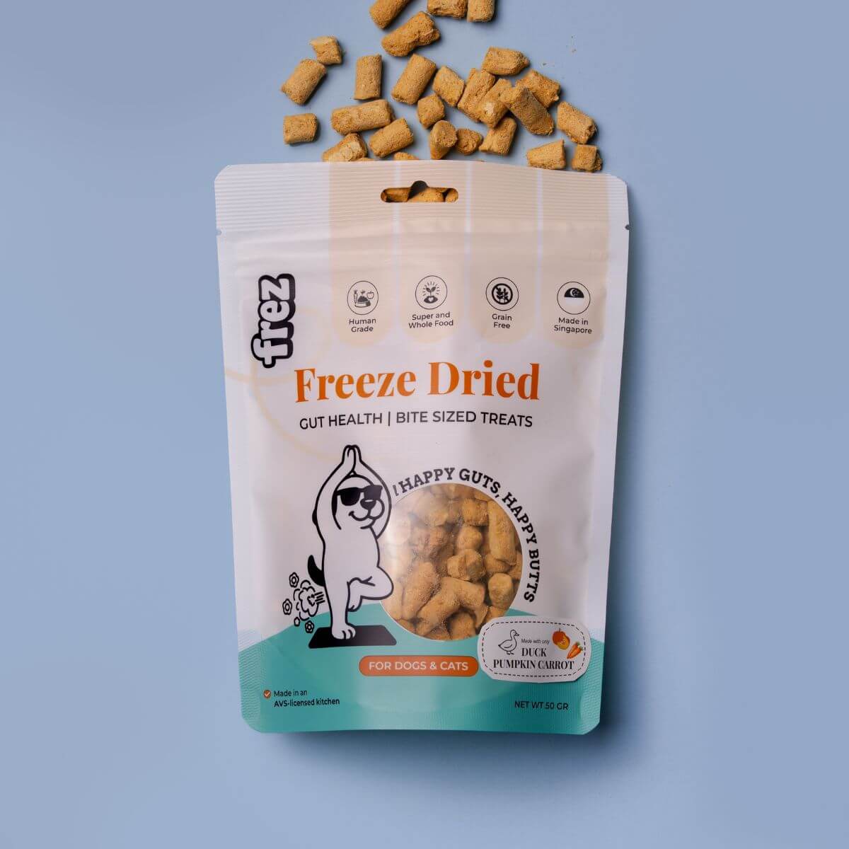 Frez Guts Health Freeze Dried Duck with Pumpkin & Carrot Treats against a blue background.