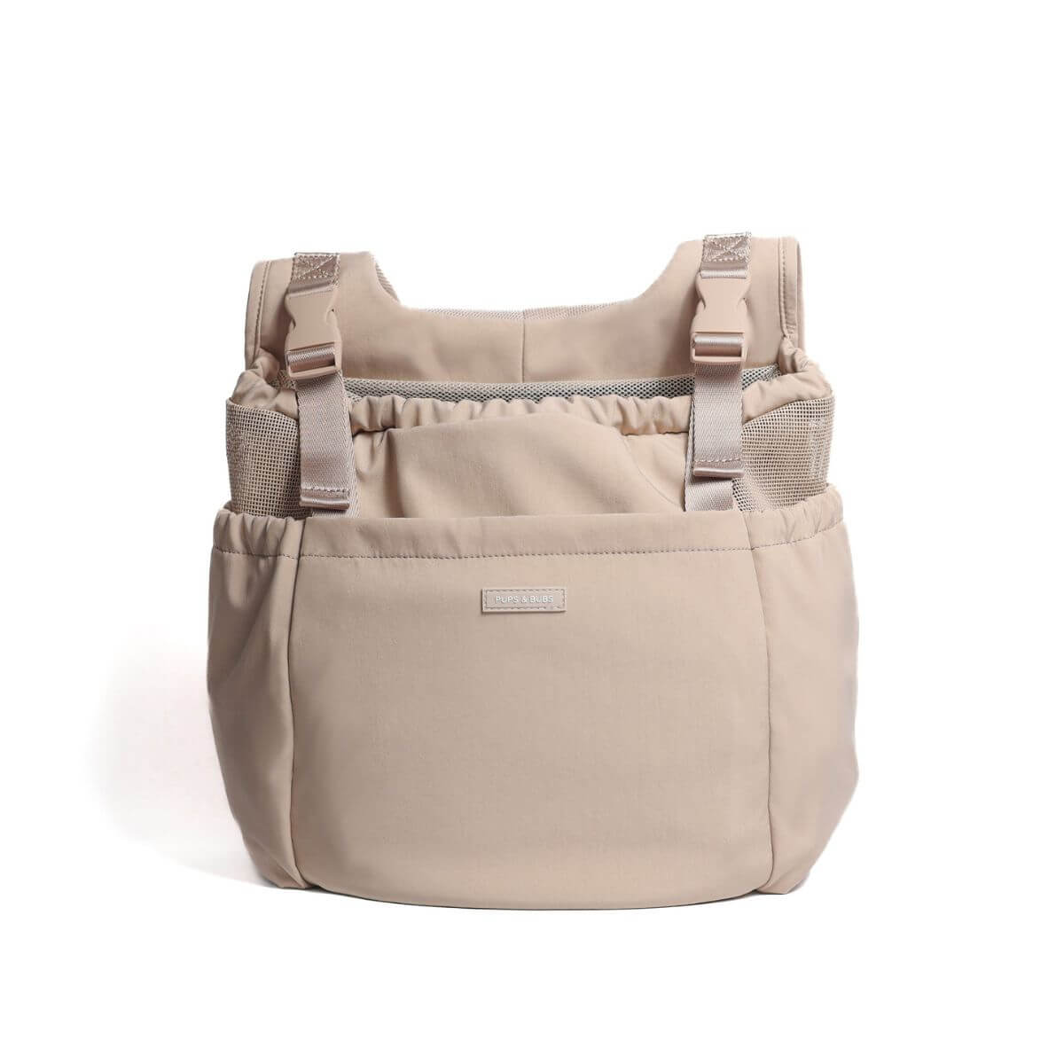 Pups and Bubs Let's Adventure Backpack in Desert against a white background.