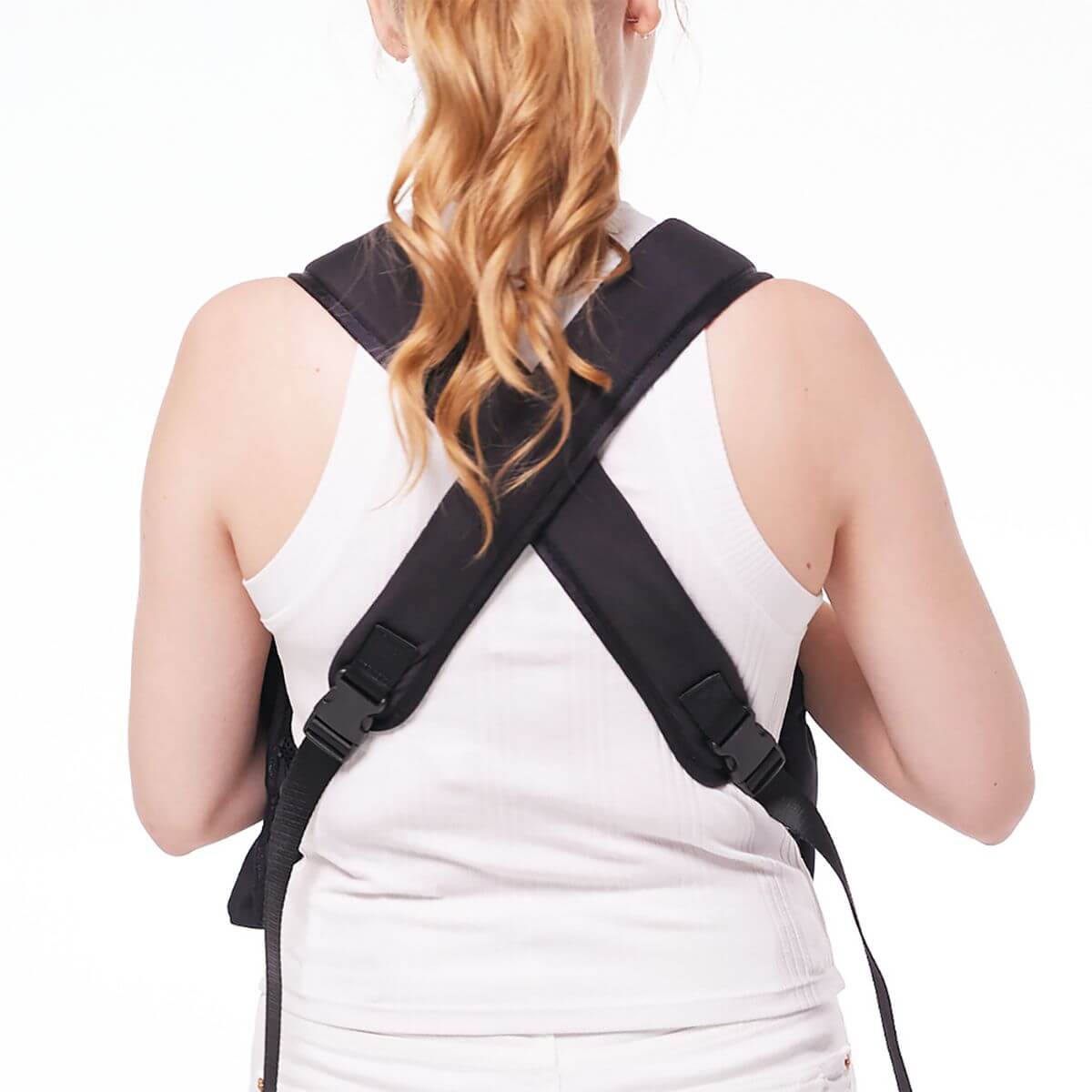 Pups and Bubs Let's Adventure Backpack in Black against a white background showcasing the cross back straps. 