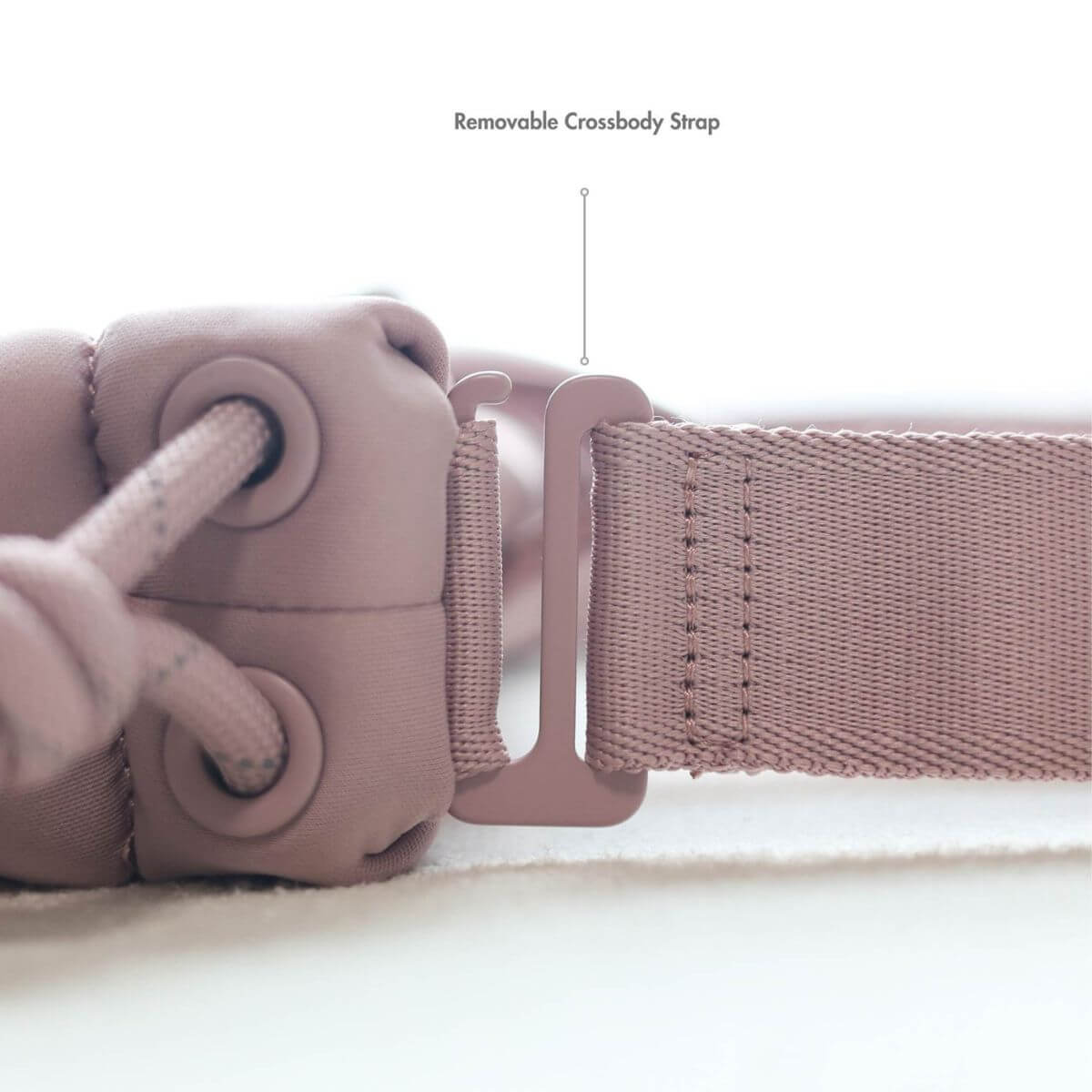 The removable crossbody strap on the Pups and Bubs All Day Chill Bag in Rose. 