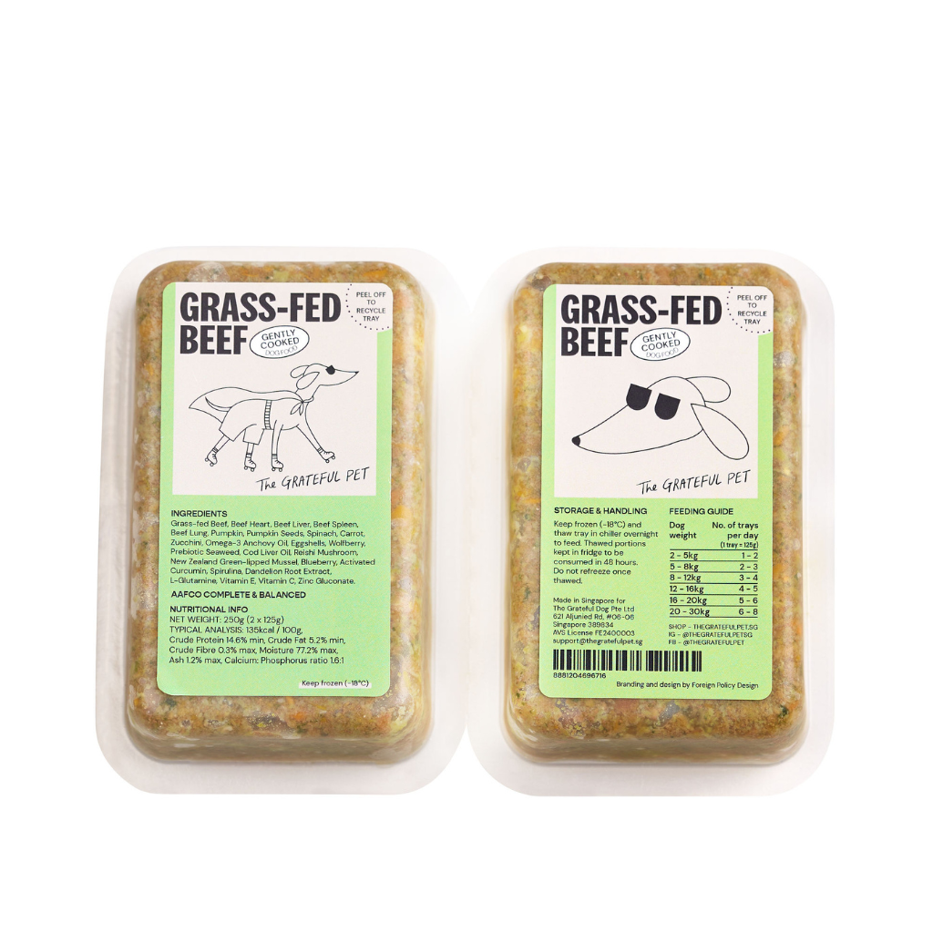 Two packages of grass-fed beef for dogs with labels on a white background