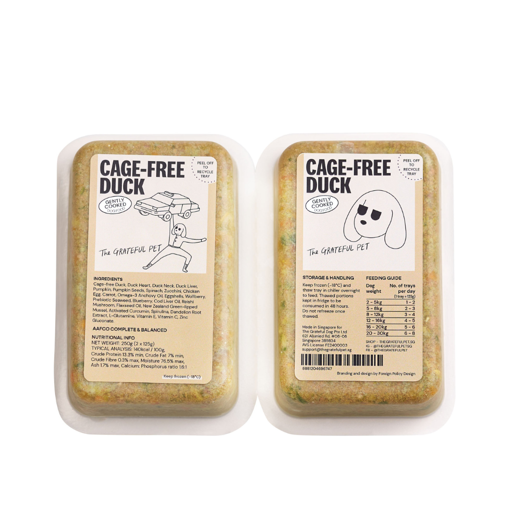 Two packages of 'Cage-Free Duck' pet food from 'The Grateful Pet' on a white background.