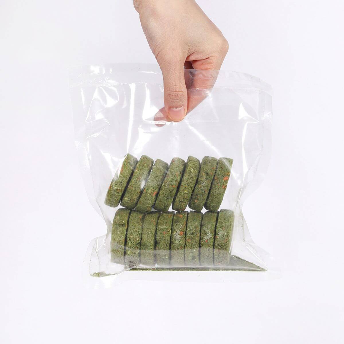 Arlo Kitchen Detox Veggie Patties against a white background in a transparent bag.