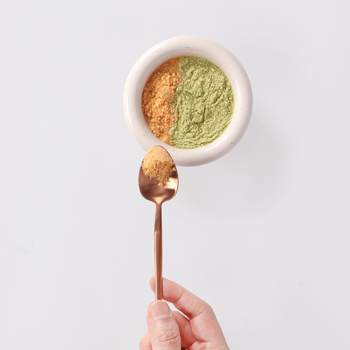 Arlo Kitchen Goat Milk Propolis treats grinded to powder in a bowl.