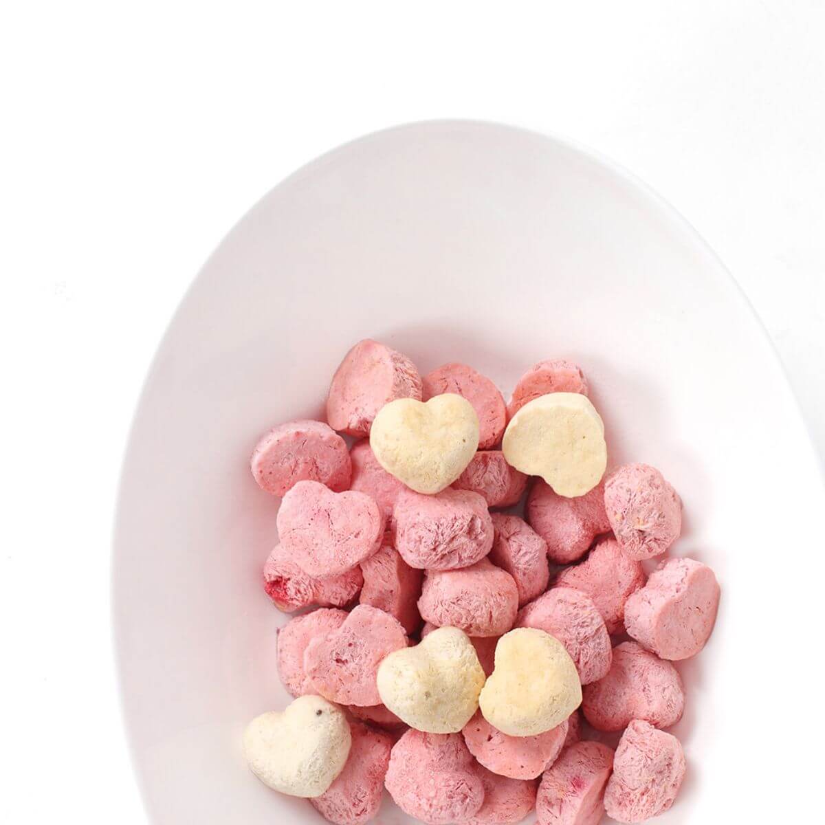 A bowl of Arlo Kitchen Oneday Yogurt Strawberry and Beet against a white background.