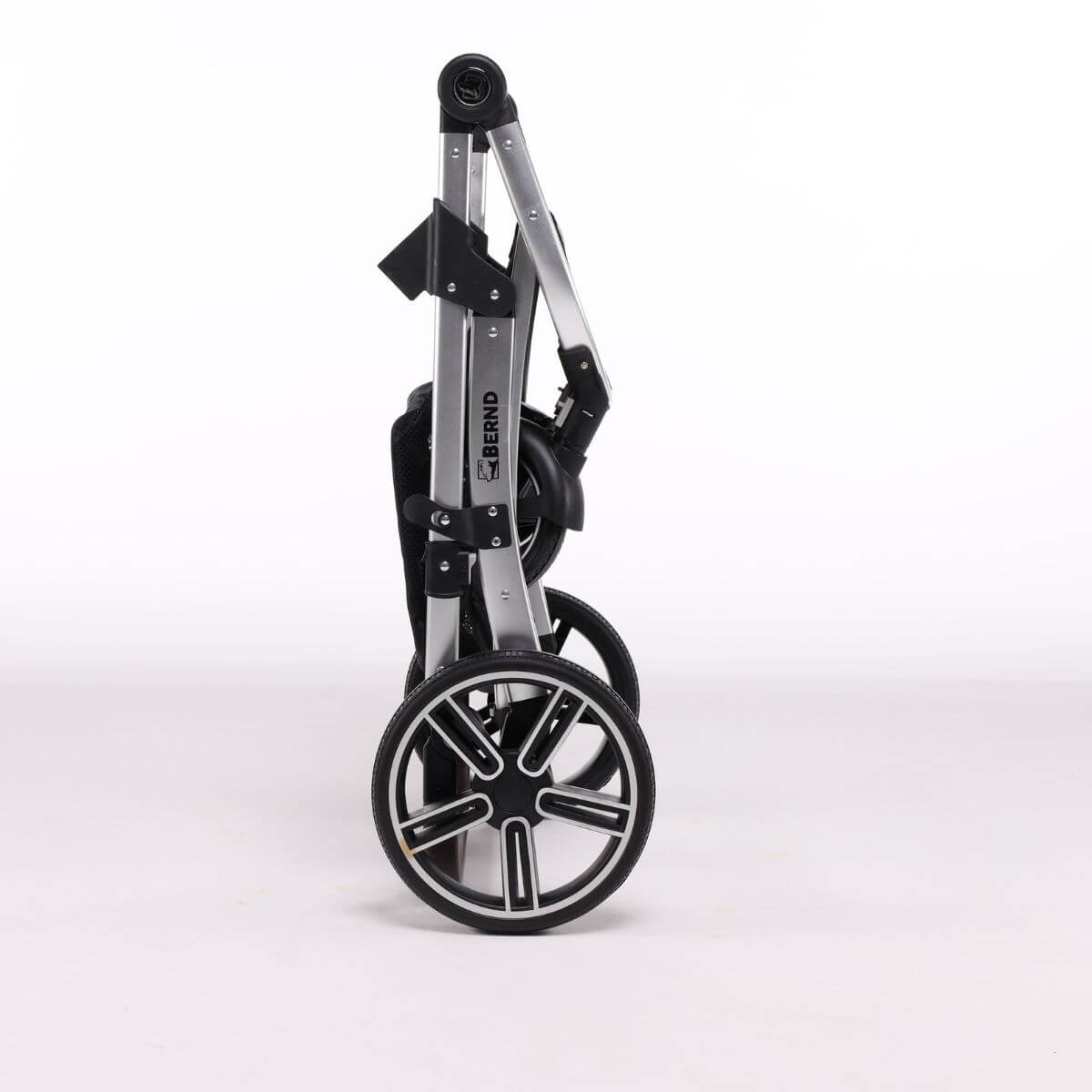 Folded frame of the Bernd Pets Prime V2 with ISOFIX Glacier Grey against a white background.