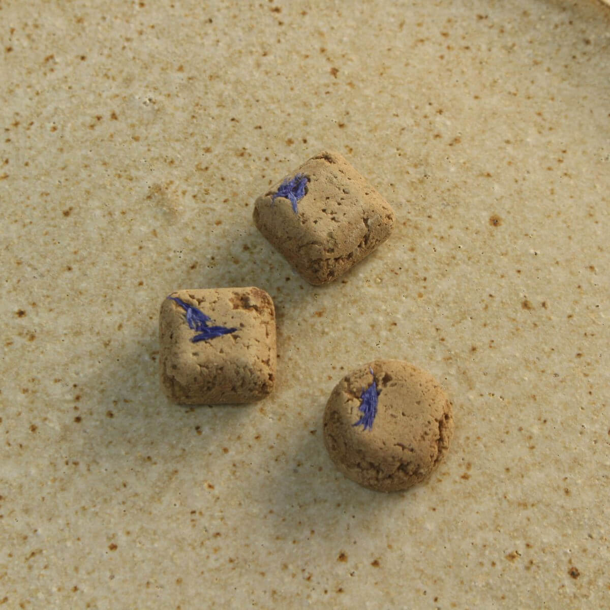 Three pieces of the In Good Thyme Duck Chocolate on a plate.