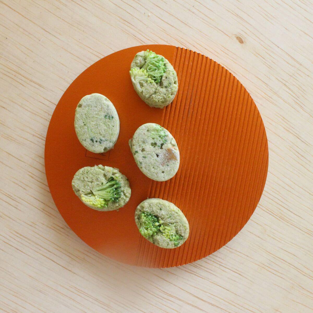 In Good Thyme Morning Dew Rabbit Treats on an orange plate.