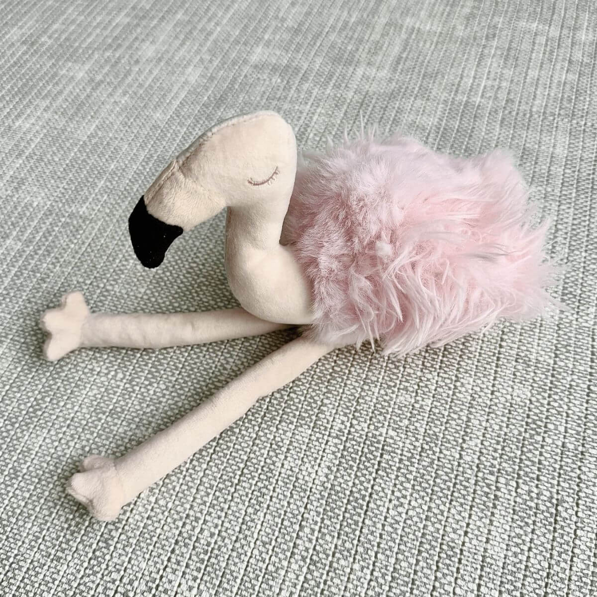 lambwolf flamingo on a sofa