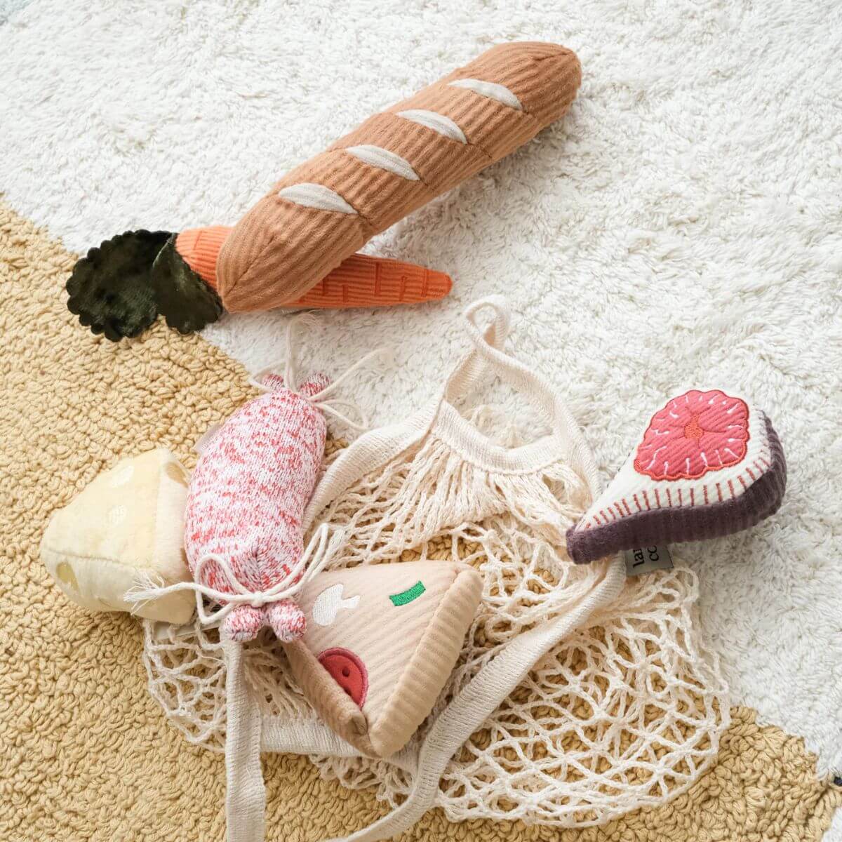 Lambwolf Mini Grocer against a rug.