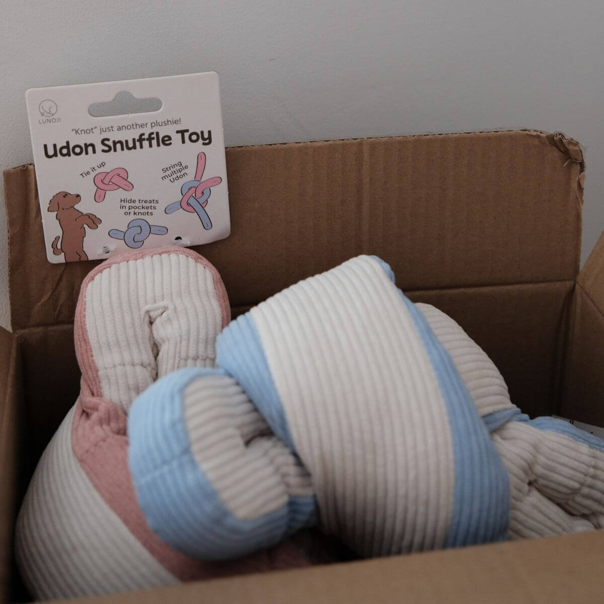 Lunoji Udon Snuffle Blush Pink and Powder Blue in a cardboard box.