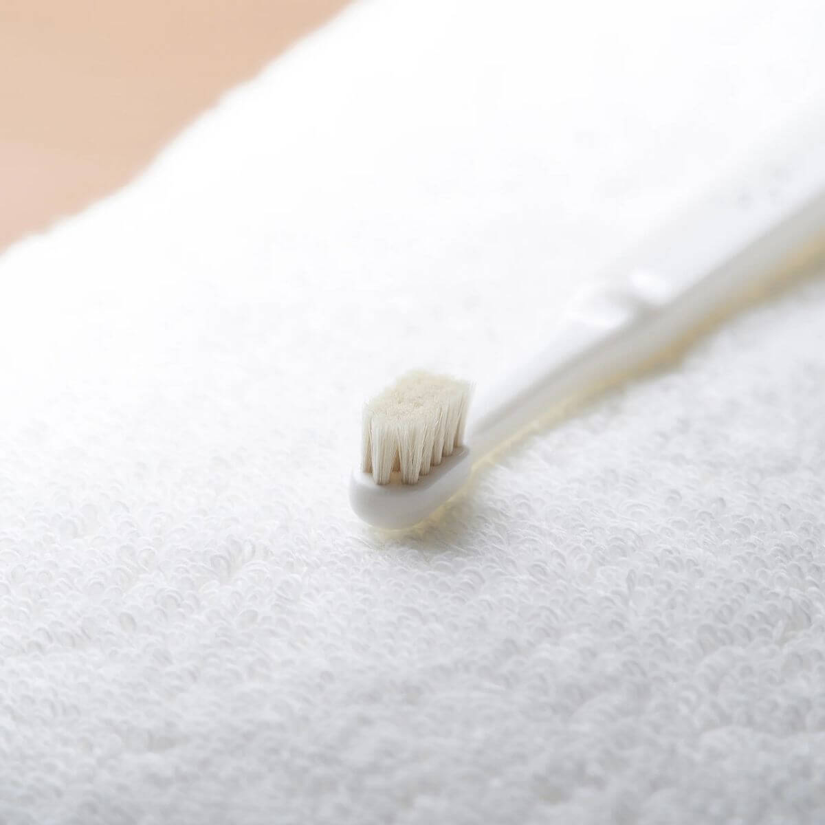 MIGAKENDE Goat Hair Bristle Toothbrush against a white background.