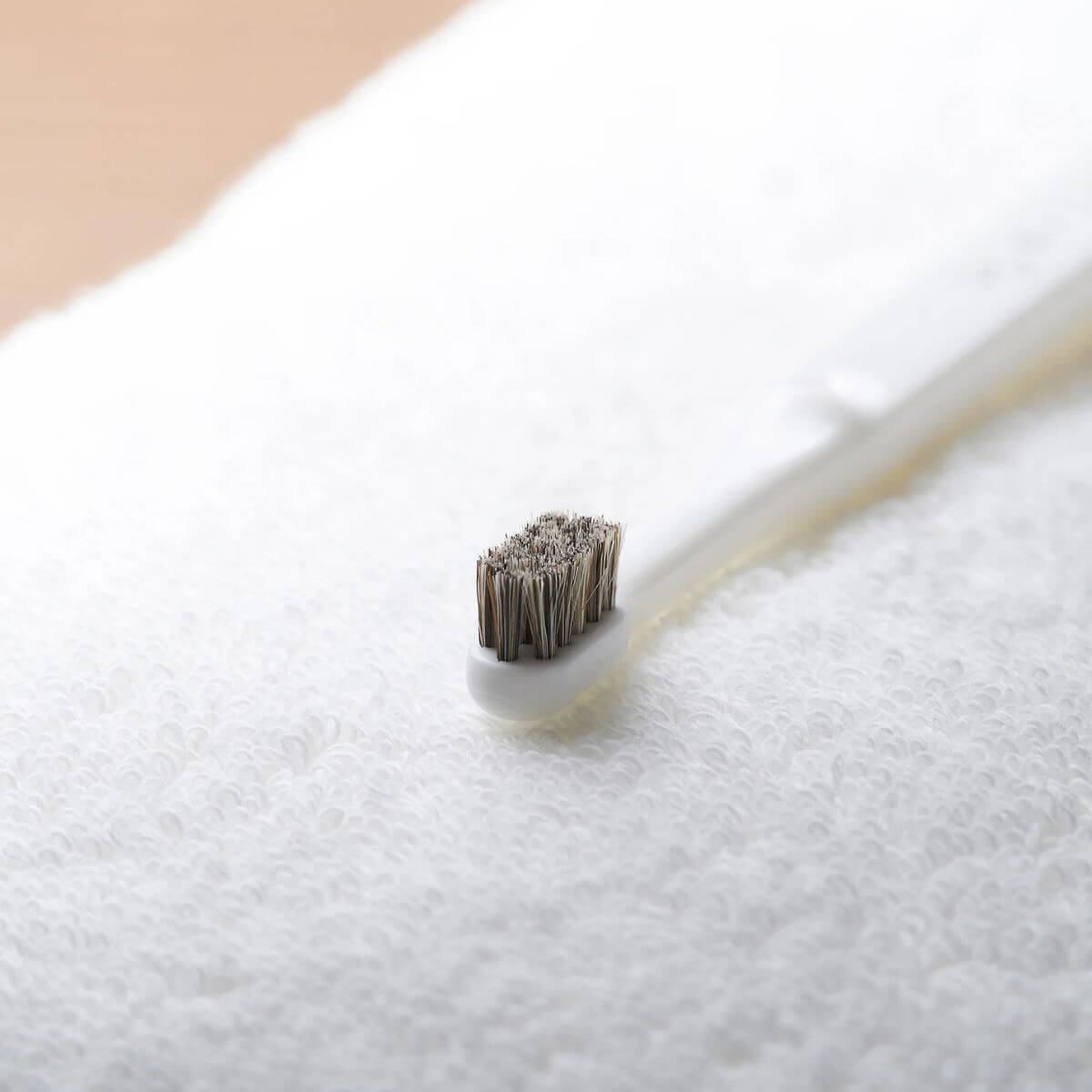 MIGAKENDE Horse Hair Bristle Toothbrush against a white background.