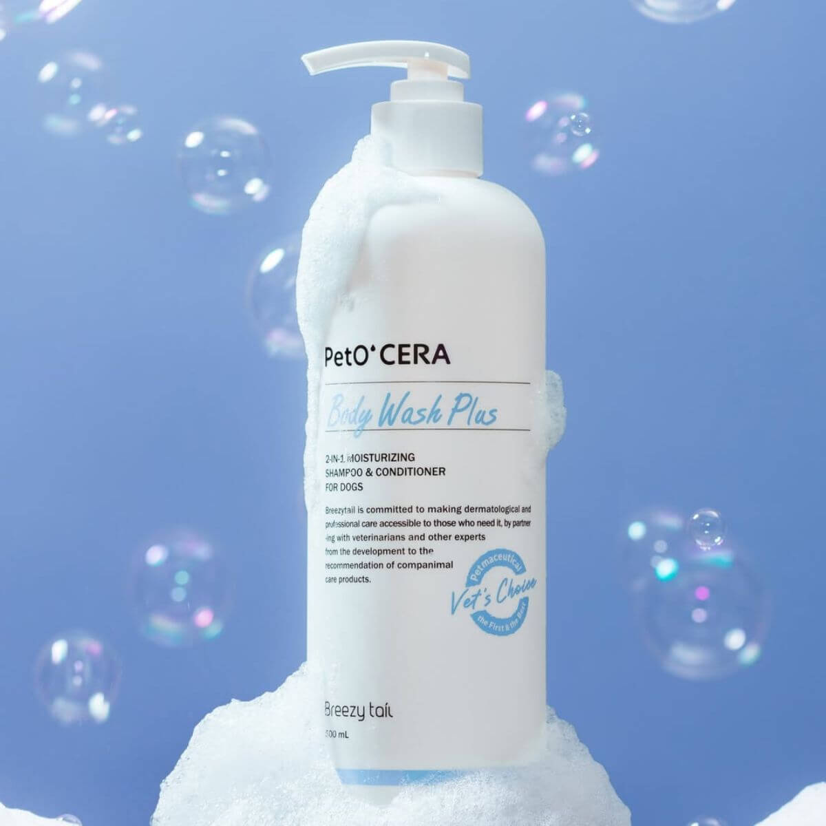PetO'CERA Body Wash Plus against a blue background with soap bubbles.