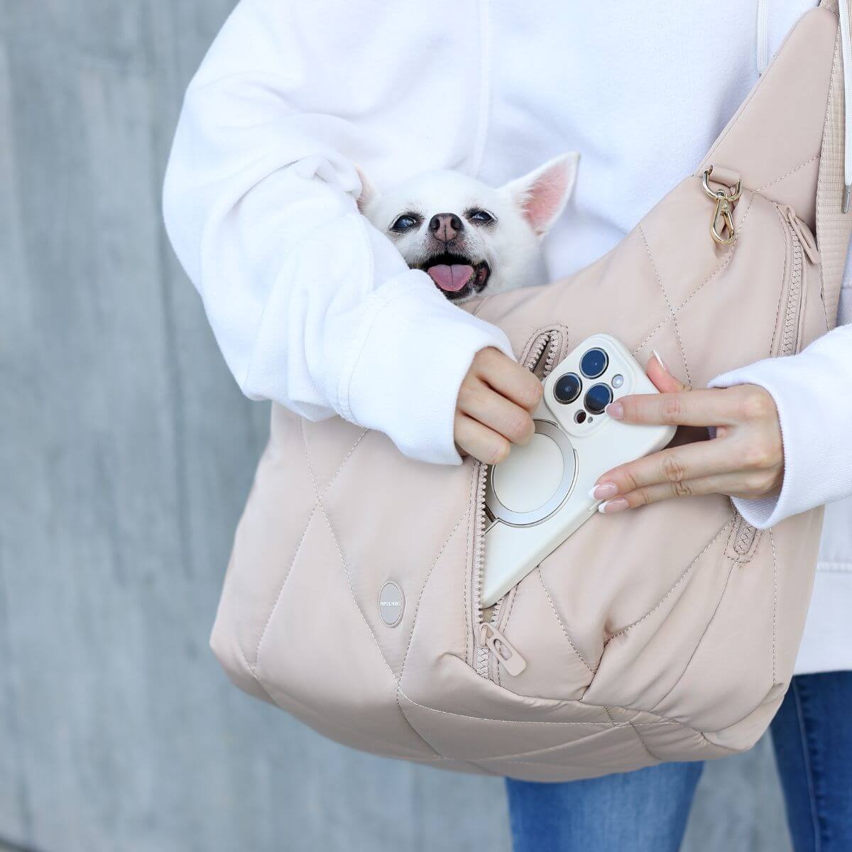 Pups & Bubs Cloud Crossbody Carrier in Latte pocket.