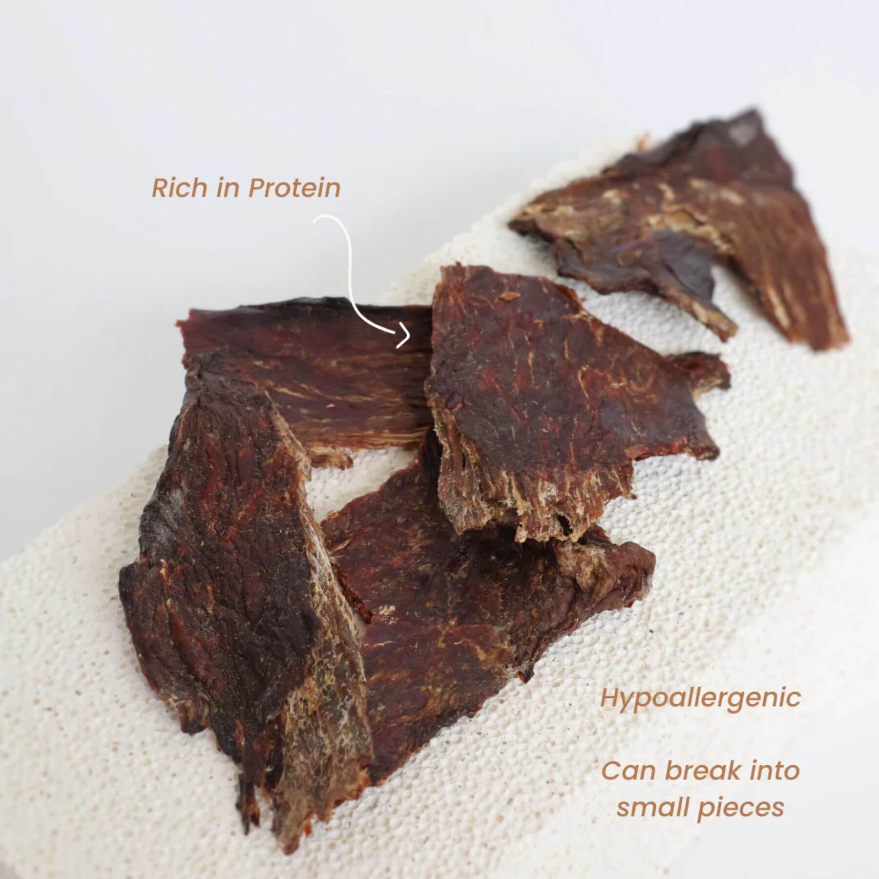 source-sage club ostrich jerky meat slice against a white background.