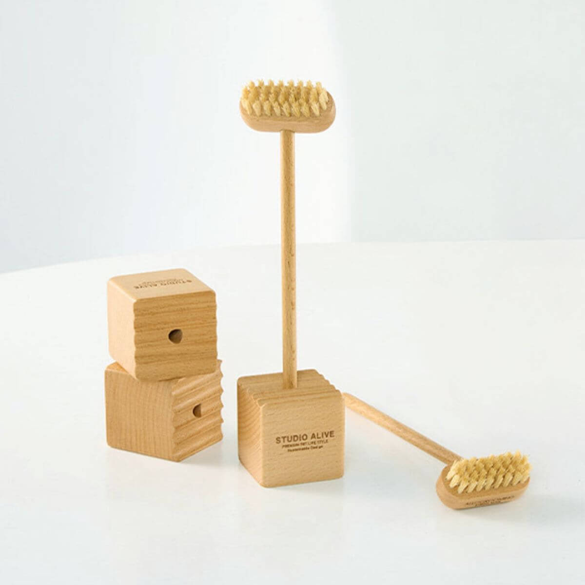 Studio Alive Allo Grooming Brush against a white background.