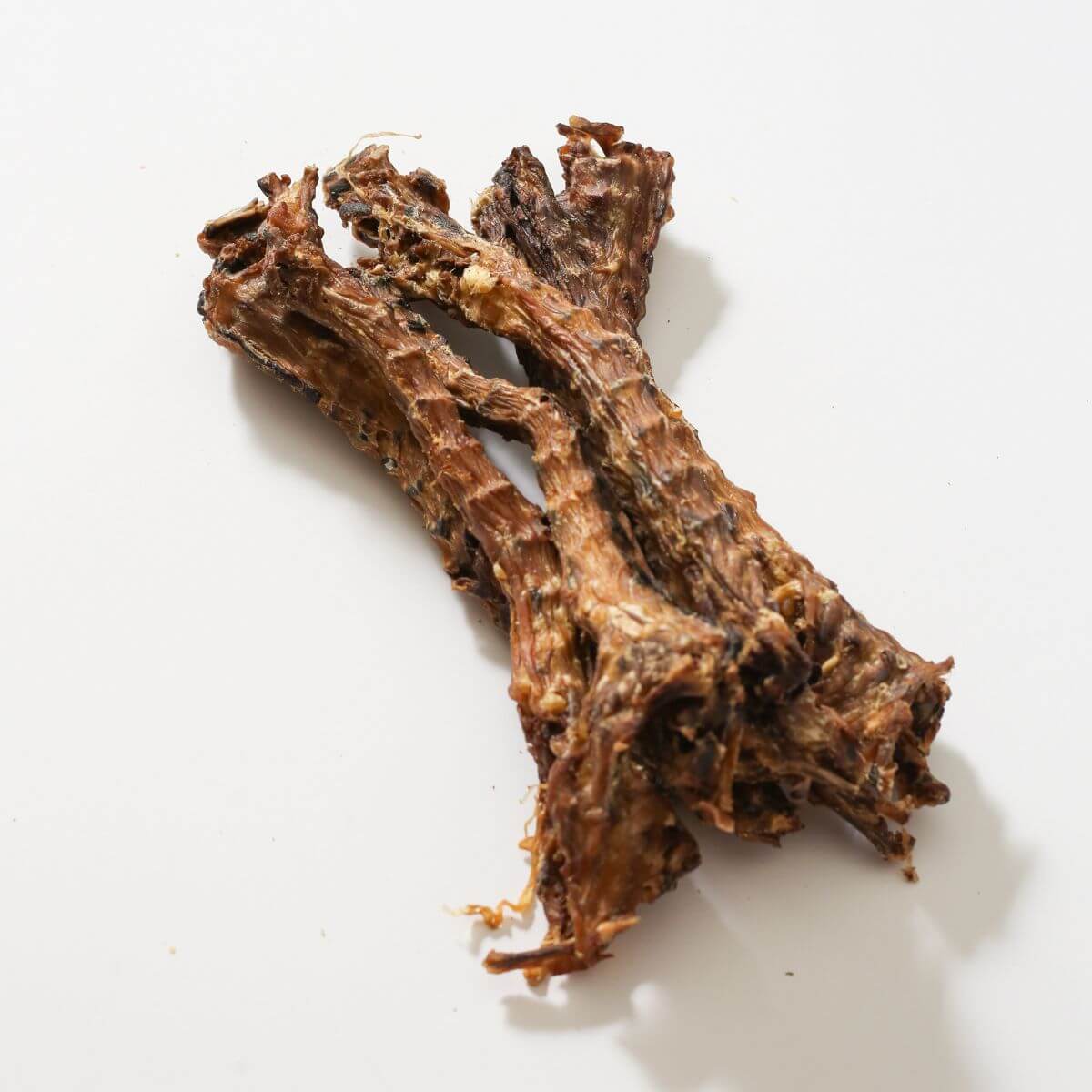 taki pets x naaf chicken necks long against a white background.