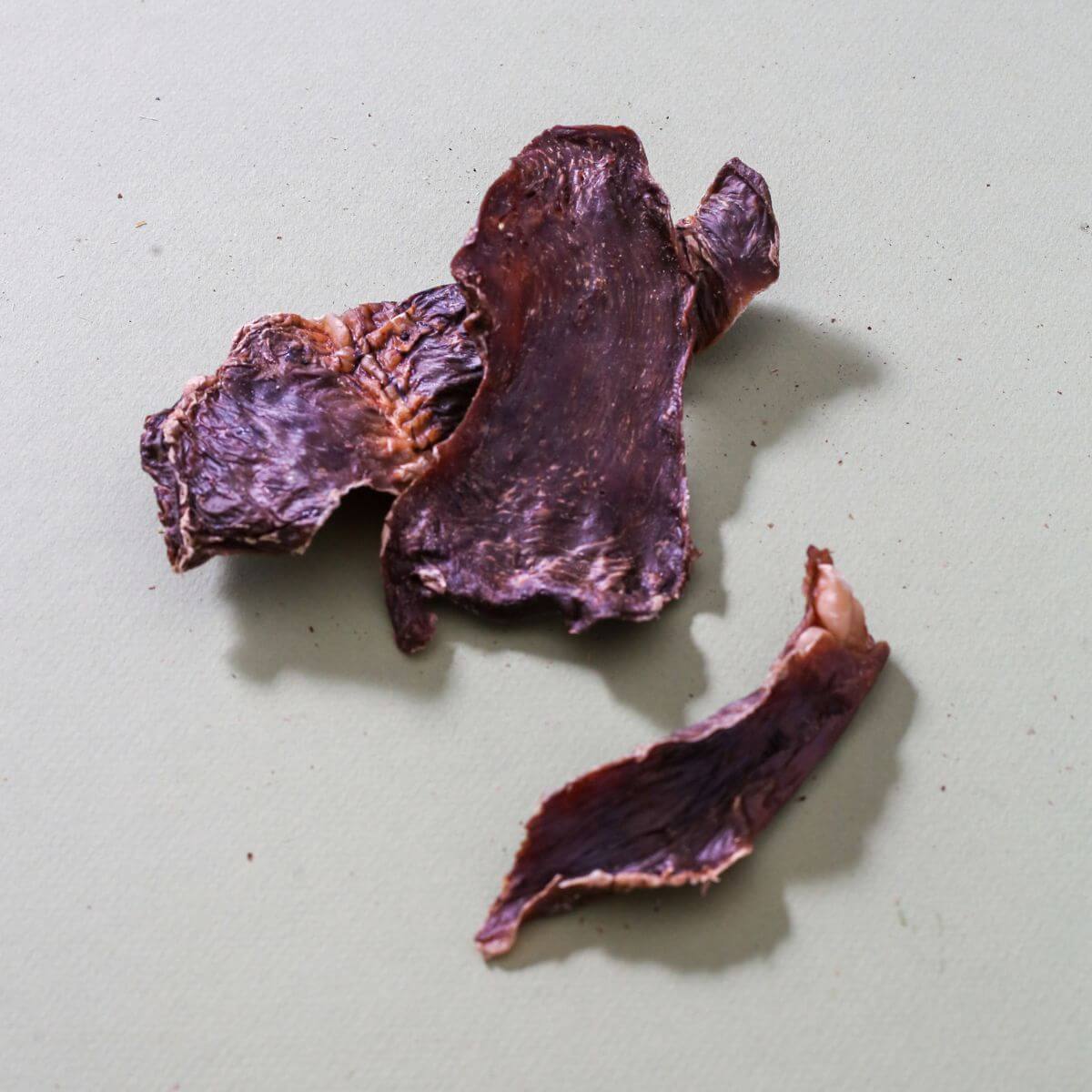 taki pets x naaf pork hearts, hatsu against a grey background.