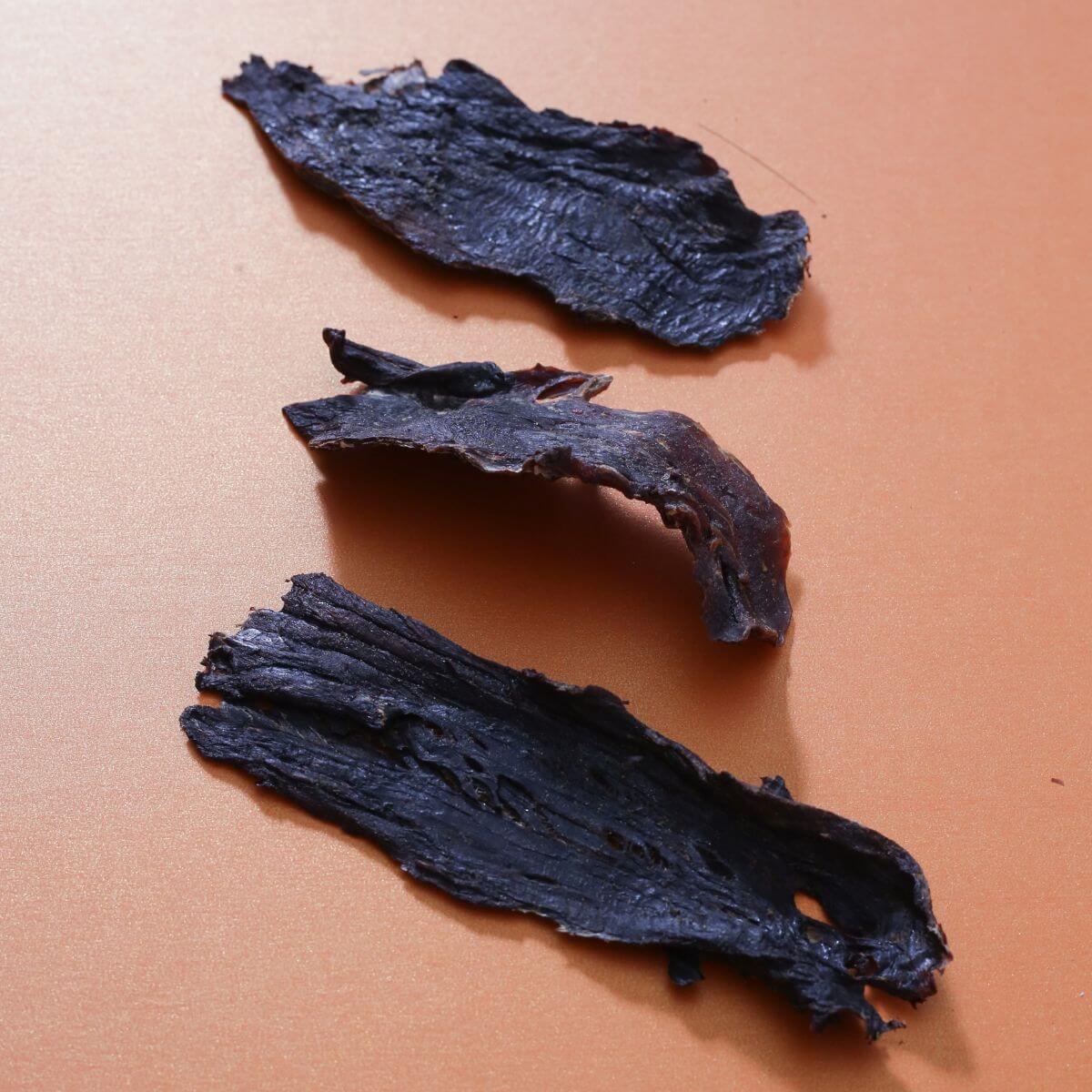 taki pets x naaf tuna lean meat against an orange background.