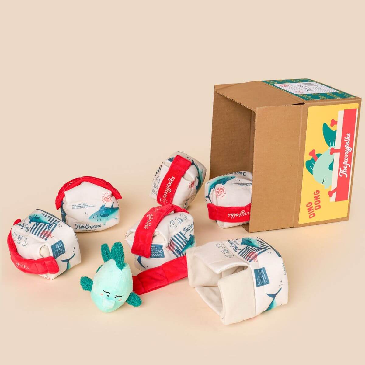 Multiple the furryfolks fish express nosework toy spilling out from cardboard boxes. 